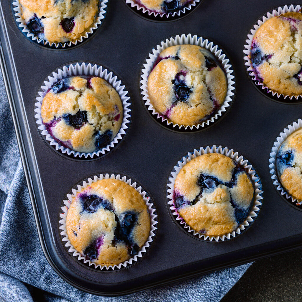 Fresh blueberry muffins in paper cases