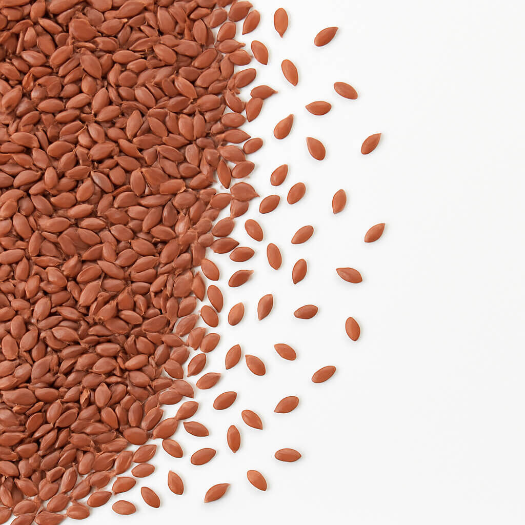 Brown flax seeds scattered on white background