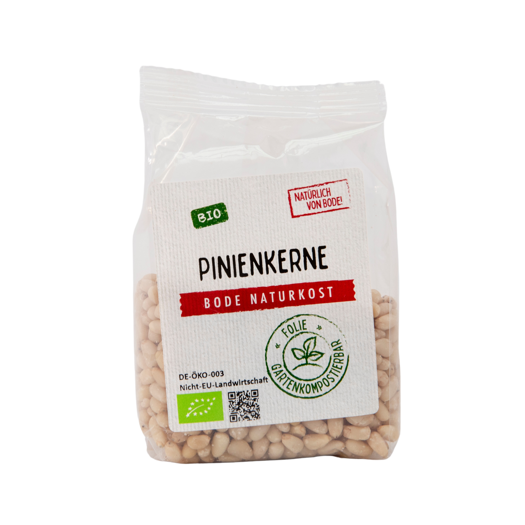 Gennemsigtig plastpose med økologiske pinjekerner fra Bode Naturkost; hvid etiket med rød og grøn økologimærkning.