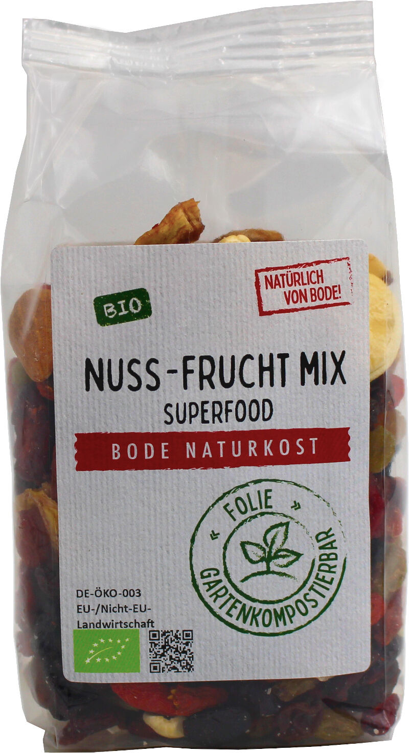Klar plastikpose med økologisk nødde- og frugtmix fra Bode Naturkost, synlig blanding af tørrede frugter og nødder, hvid etiket med teksten 'Nuss-Frucht Mix' og økologimærke.