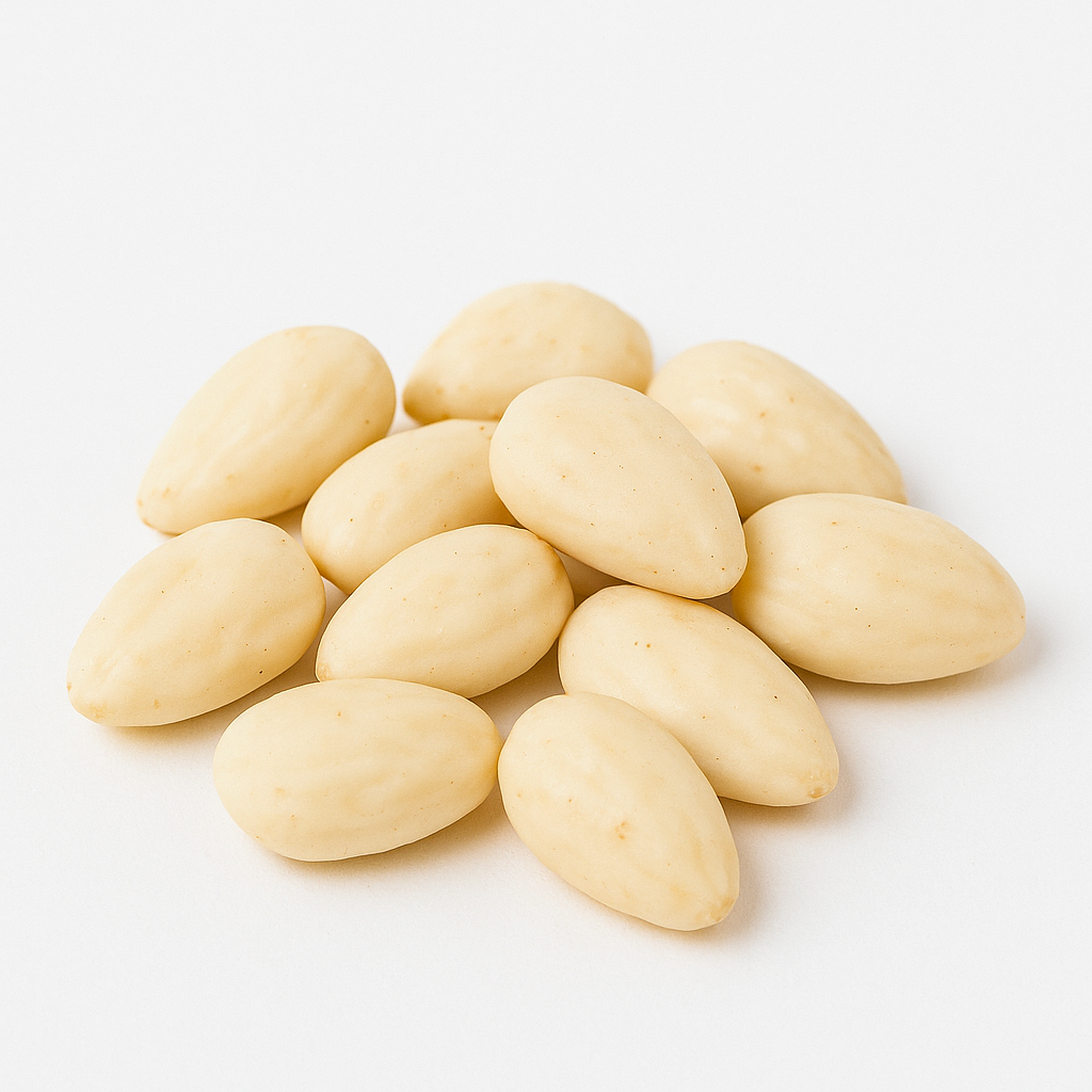 Pile of blanched almonds on white background