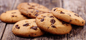 Chocolate chip cookies on wooden surface