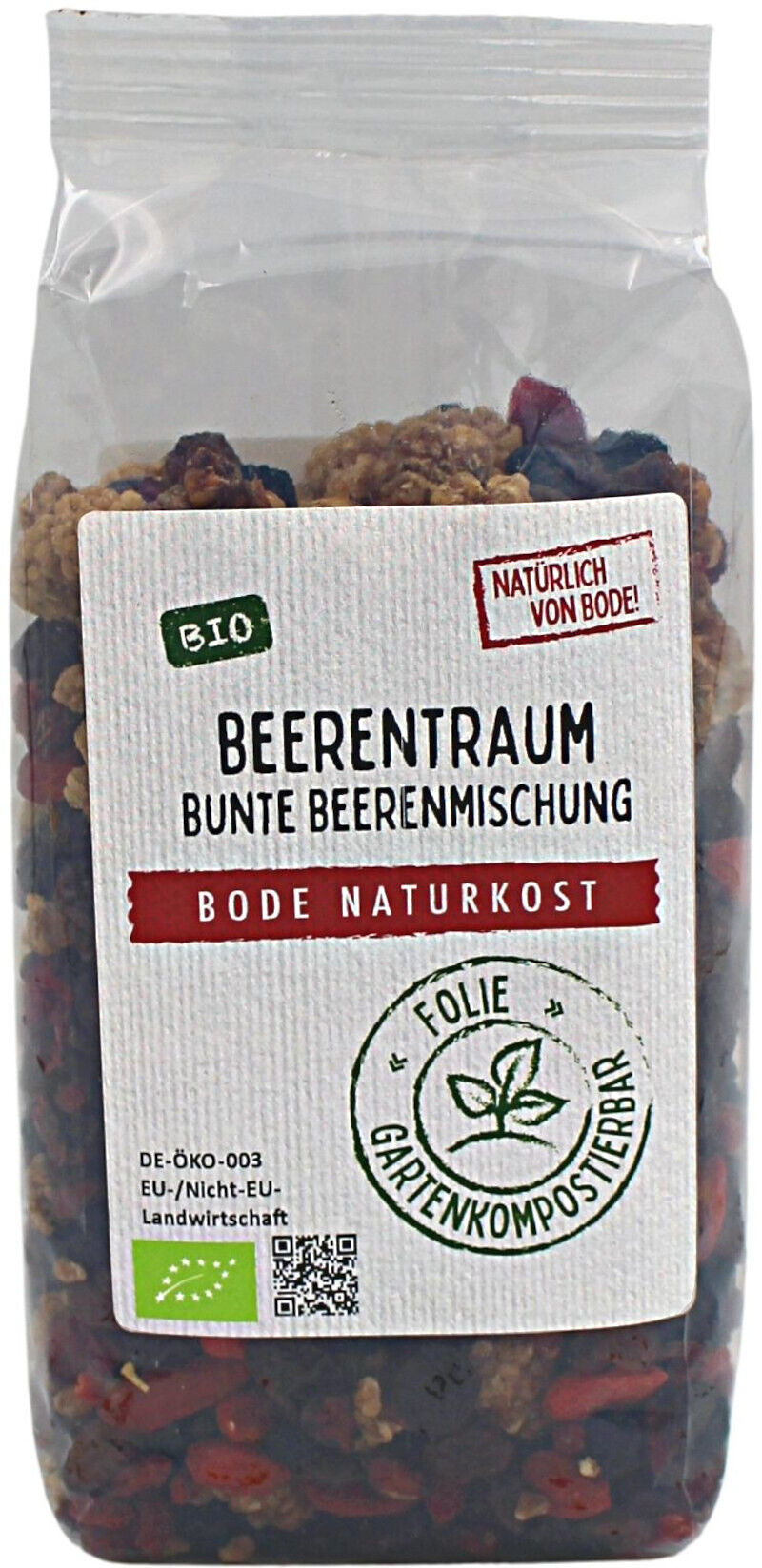 Pose med økologisk bærblanding 'Beerentraum' fra Bode Naturkost. Gennemsigtig pose med hvid etiket med produktnavn, økologimærke og stempel om komposterbar folie; synlige tørrede blandede bær.