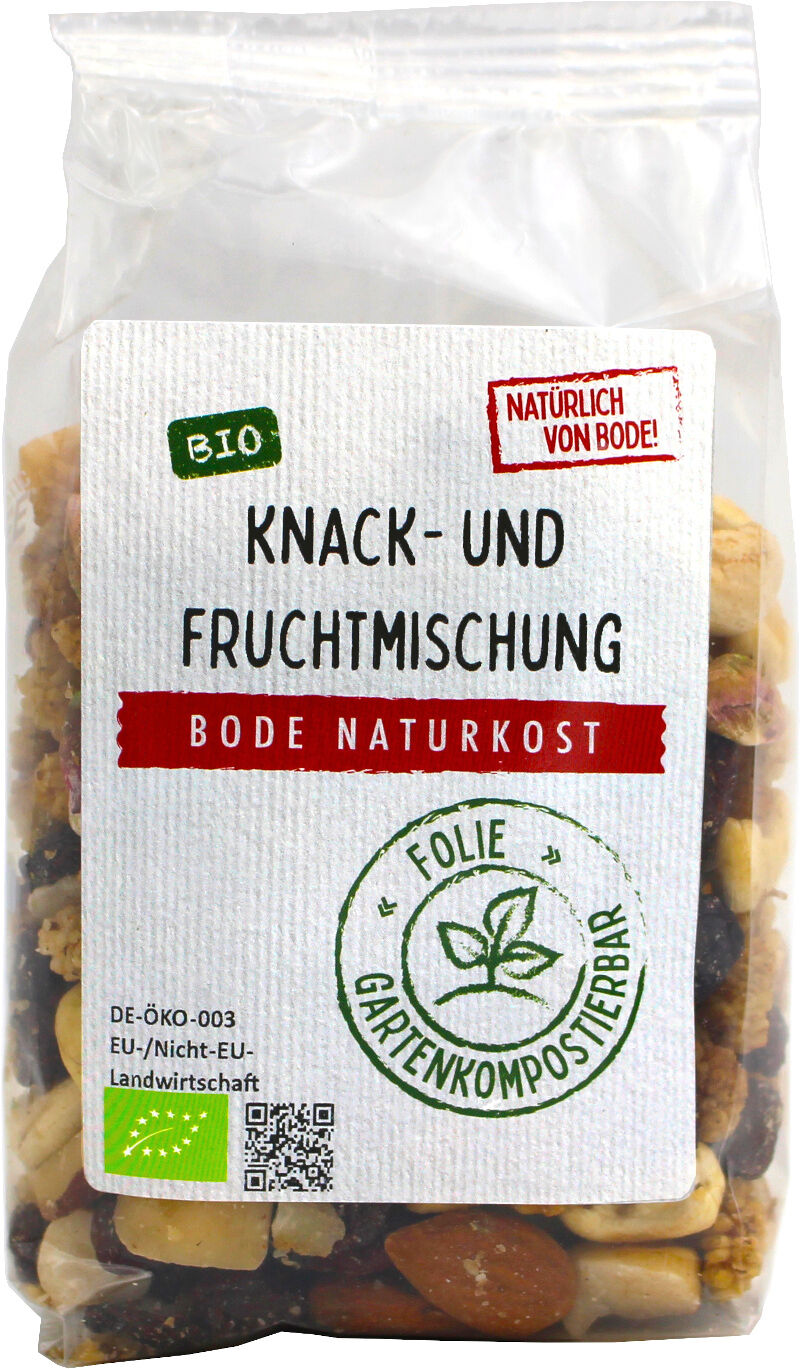 Gennemsigtig pose med Bode Naturkost økologisk knas- og frugtblanding, hvid etiket med tekst og grønt komposterbart stempel, synlige nødder og tørret frugt.