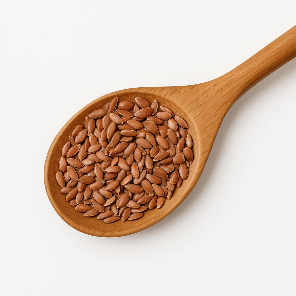 Wooden spoon filled with brown flax seeds