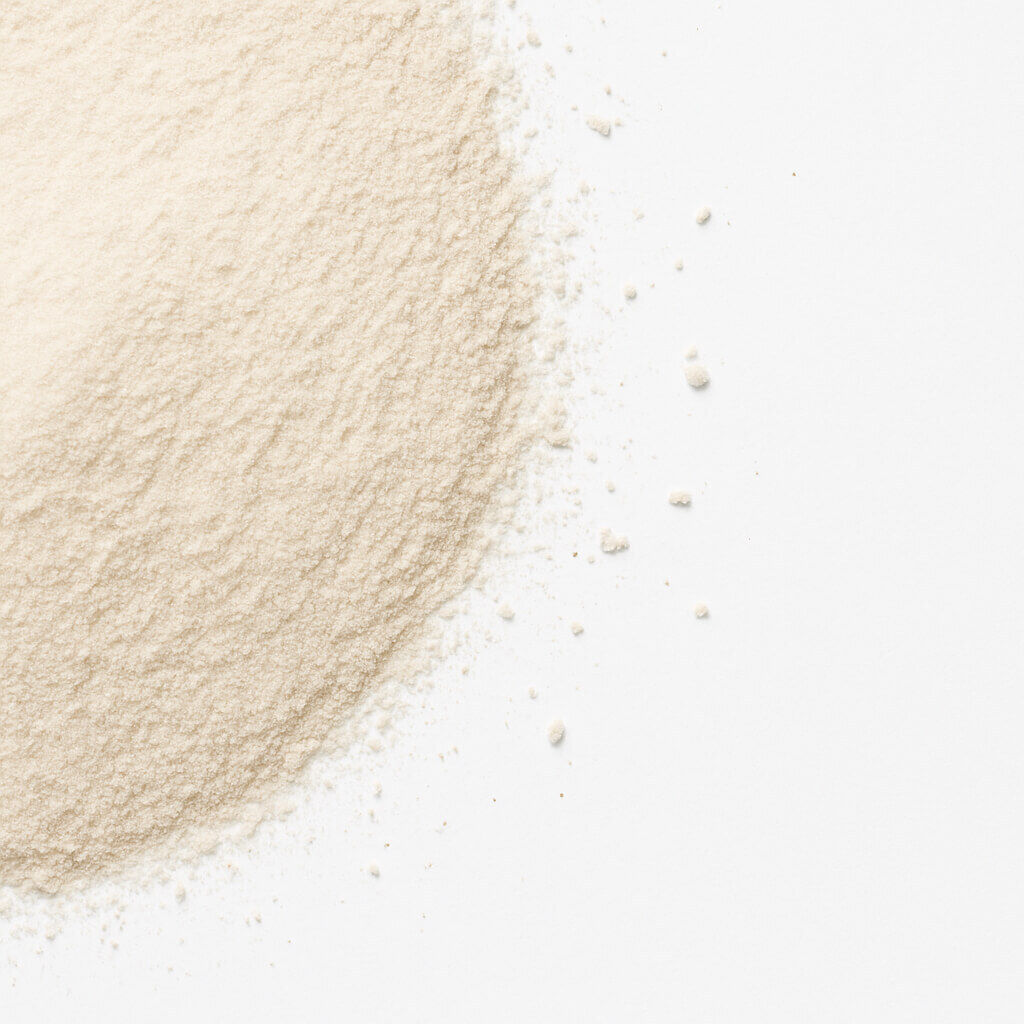 Close-up of beige powder on white surface