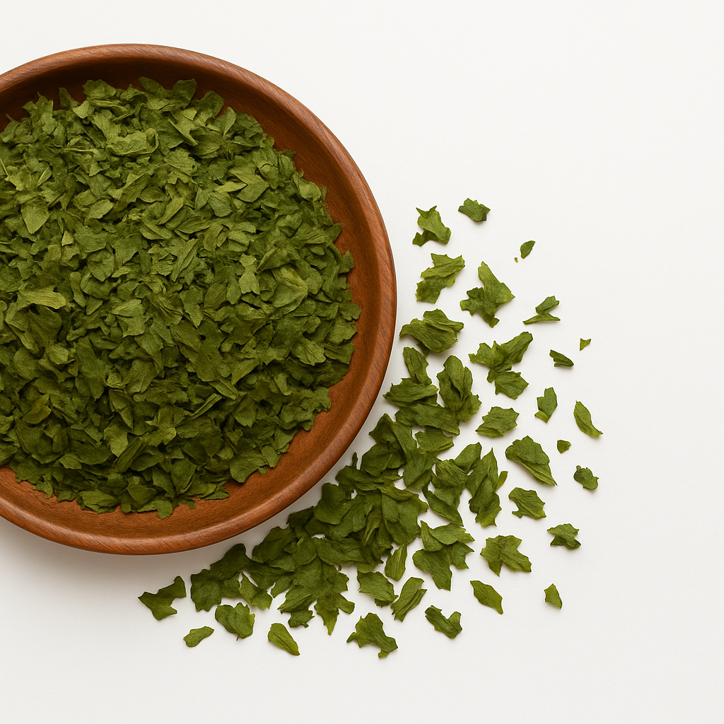 Dried parsley in a wooden bowl on white background