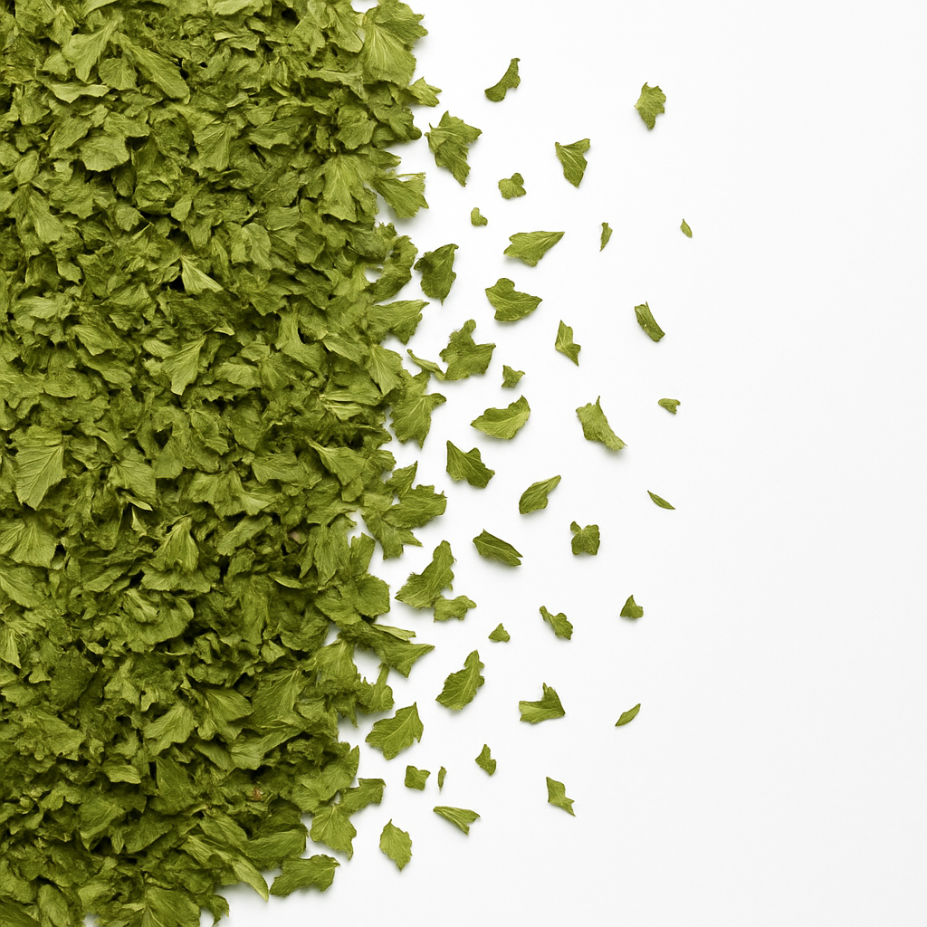 A pile of dried parsley leaves on a white background.