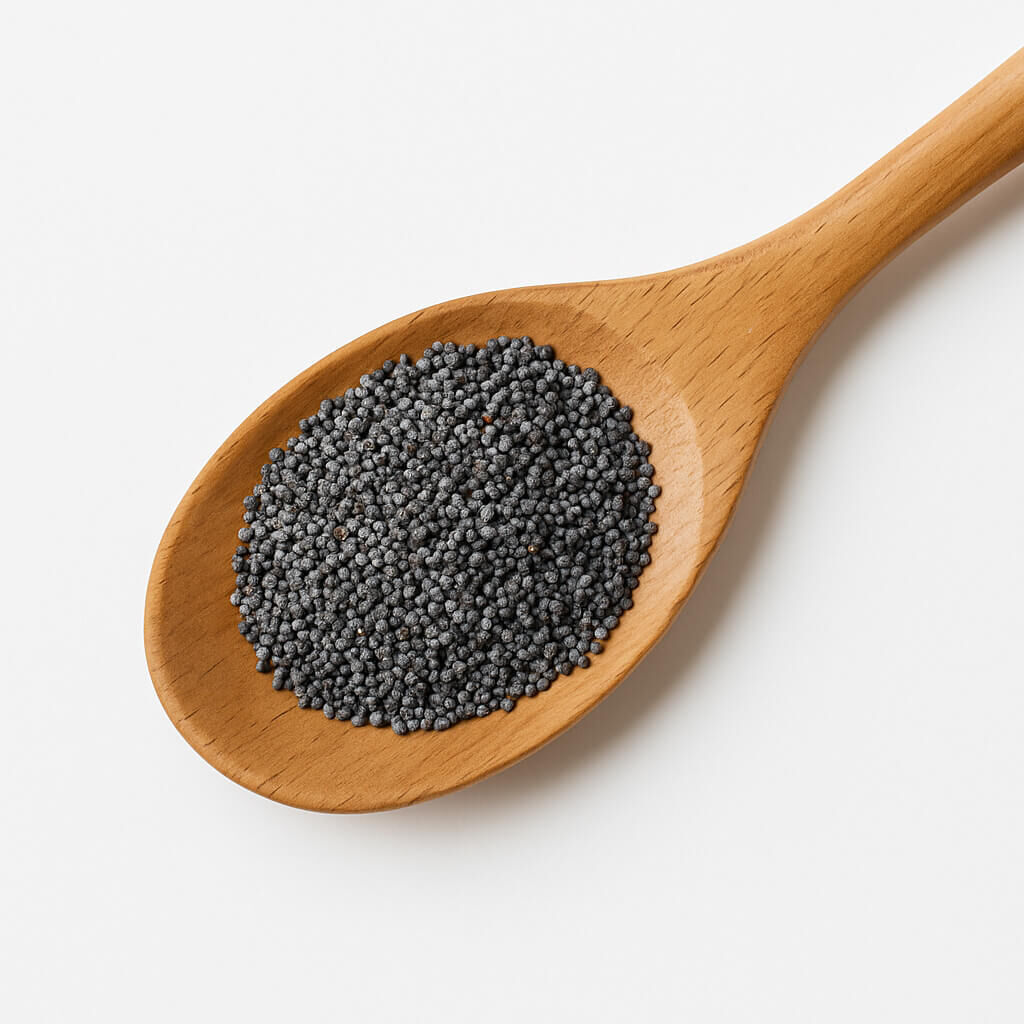 Close-up of poppy seeds in a wooden spoon