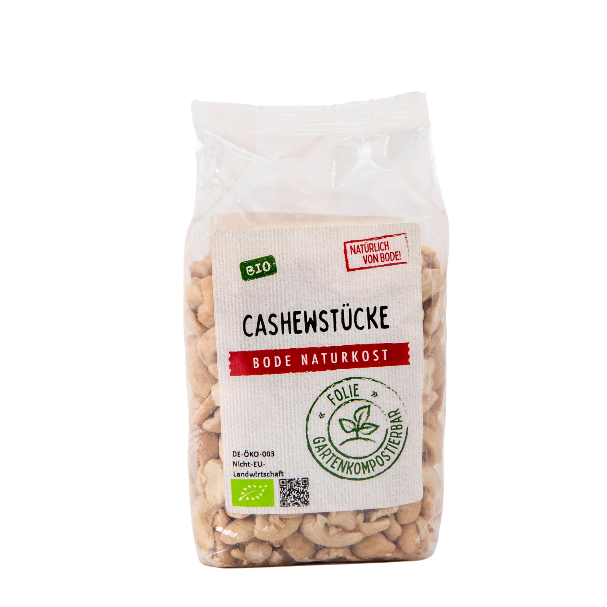 Gennemsigtig plastikpose med økologiske cashewstykker fra Bode Naturkost, synlig papirlabel med 'Bio'-mærke og symbol for komposterbar folie.