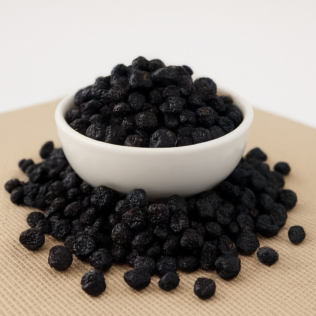 Close-up of dried blackcurrants in a white bowl