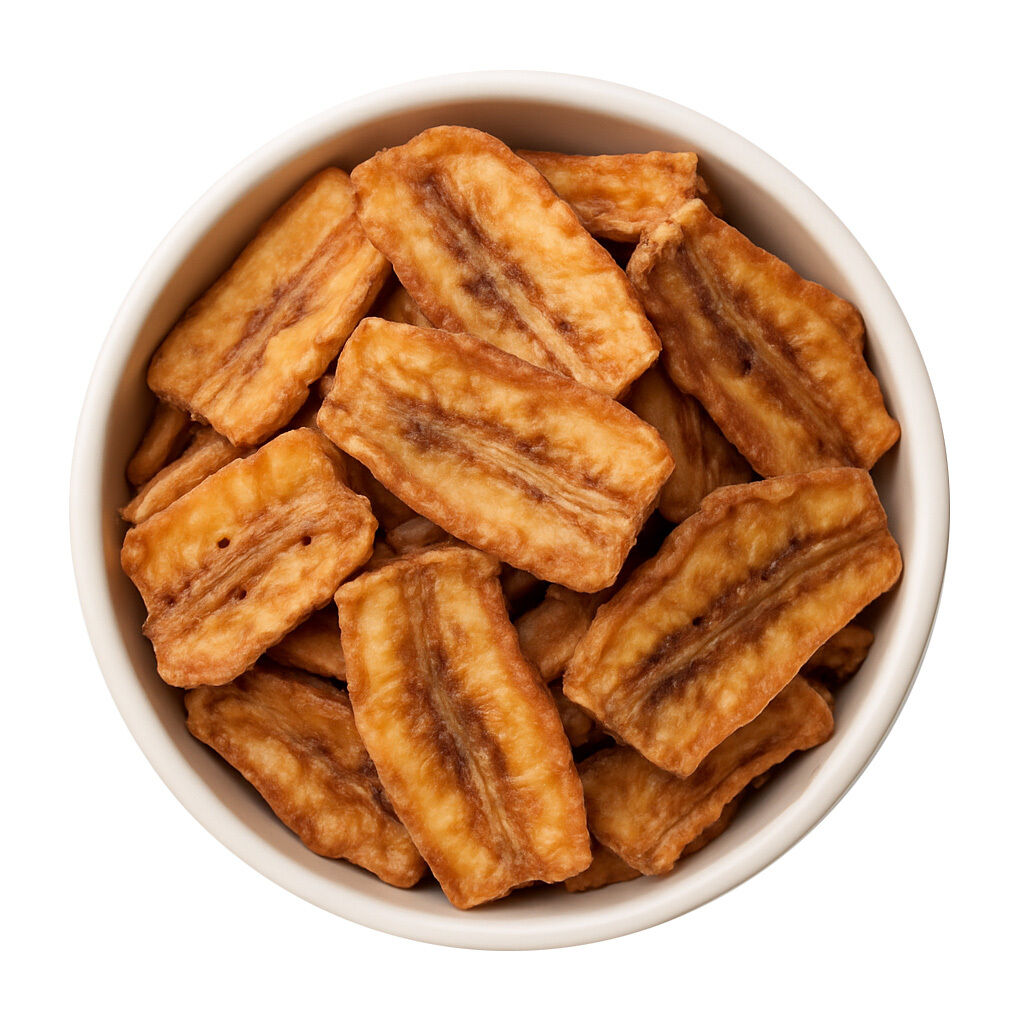 White bowl of dried banana chips, top view