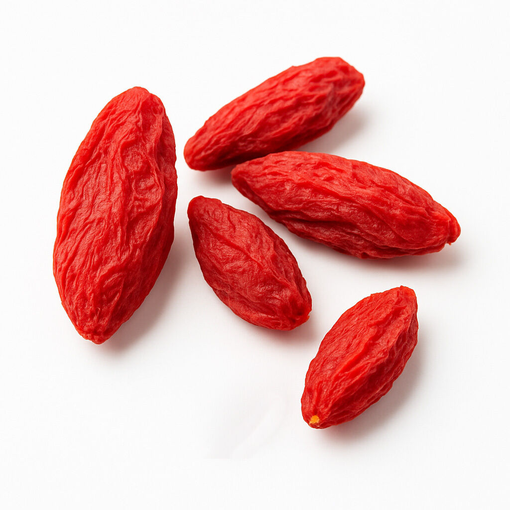 Close-up of dried goji berries on white background