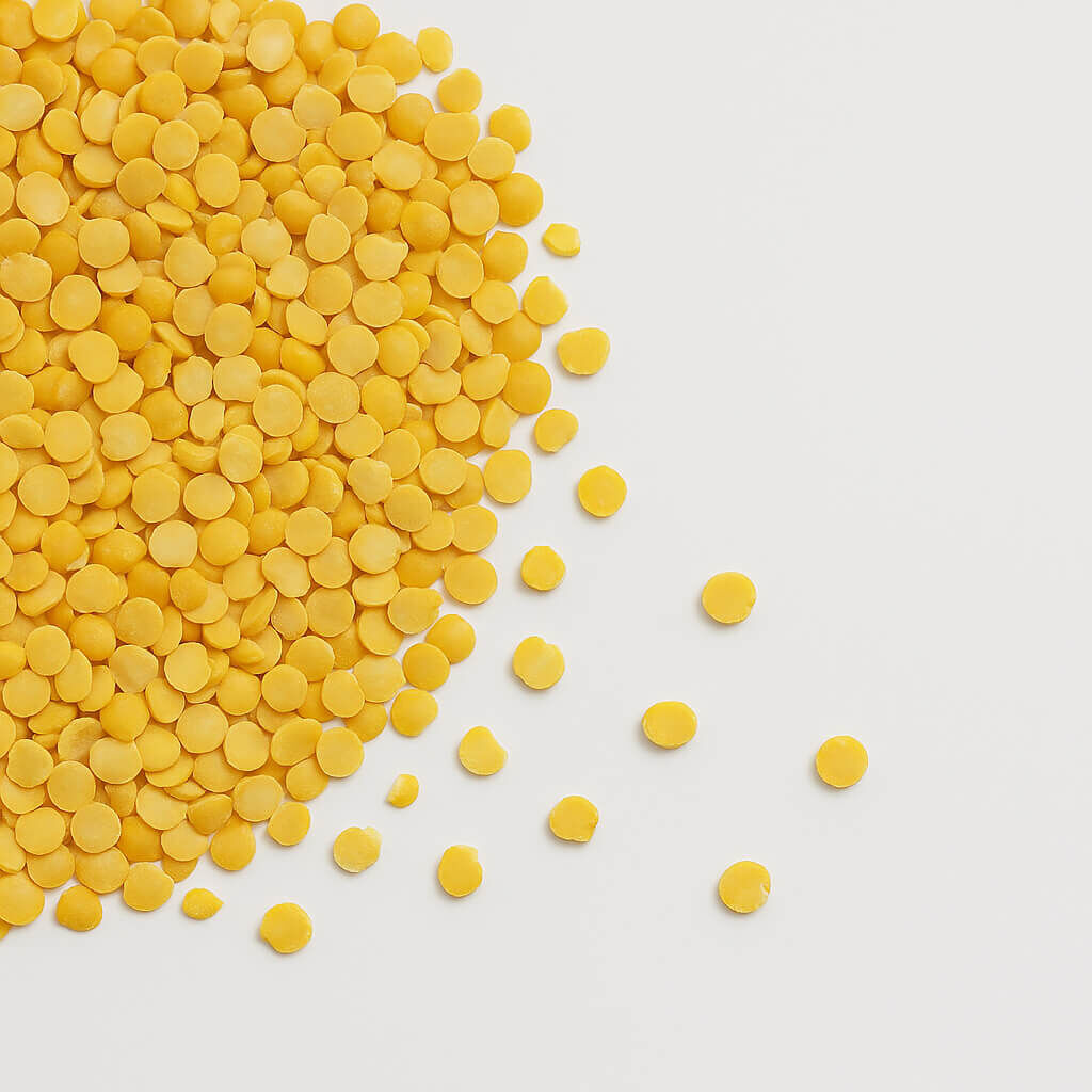 Yellow split peas on white background
