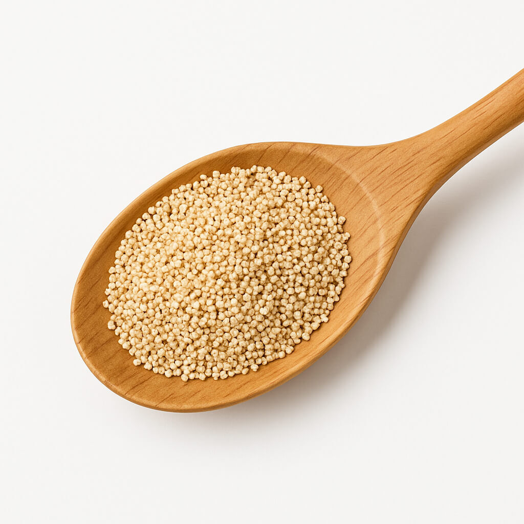 Close-up of couscous in wooden spoon