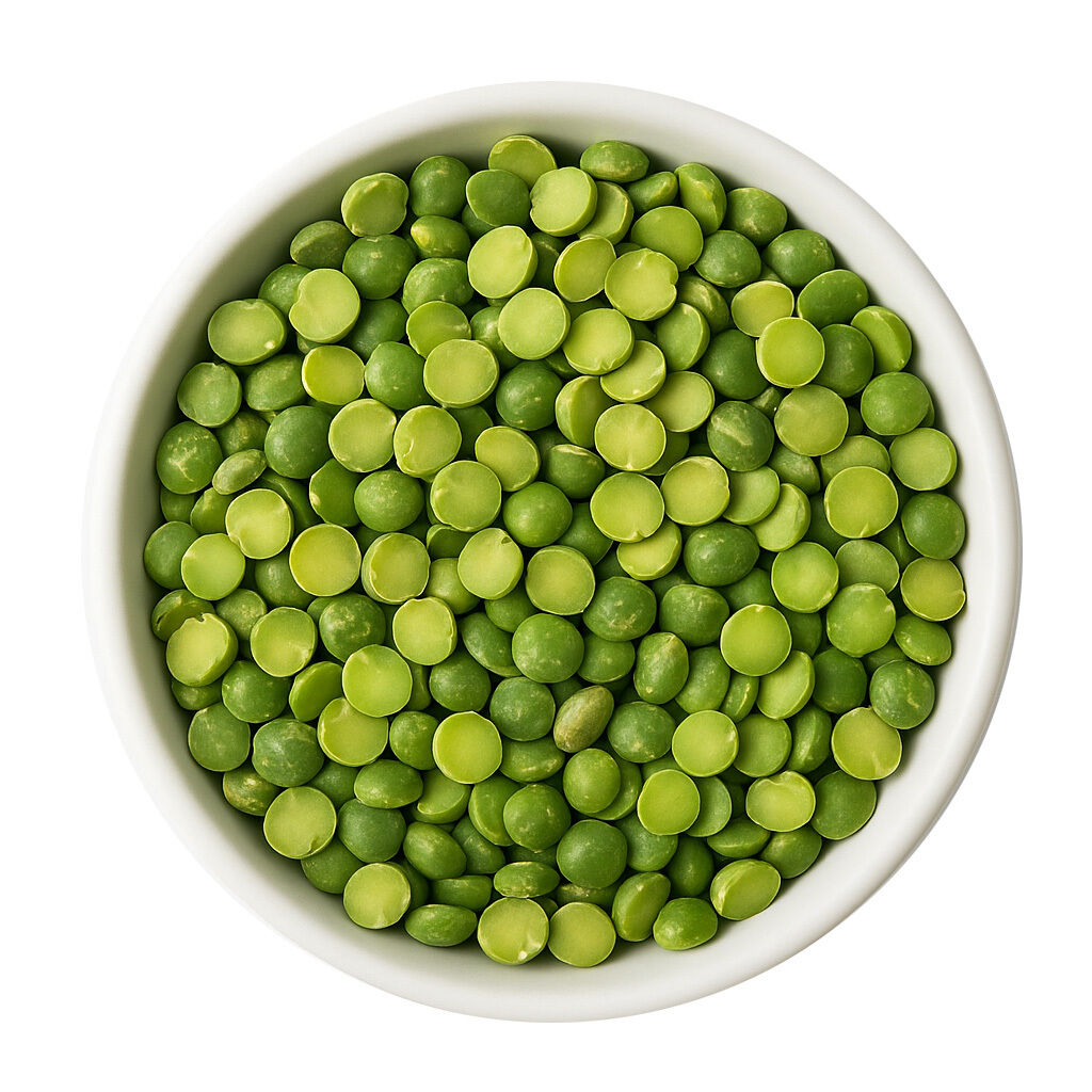 White bowl filled with green split peas, overhead view