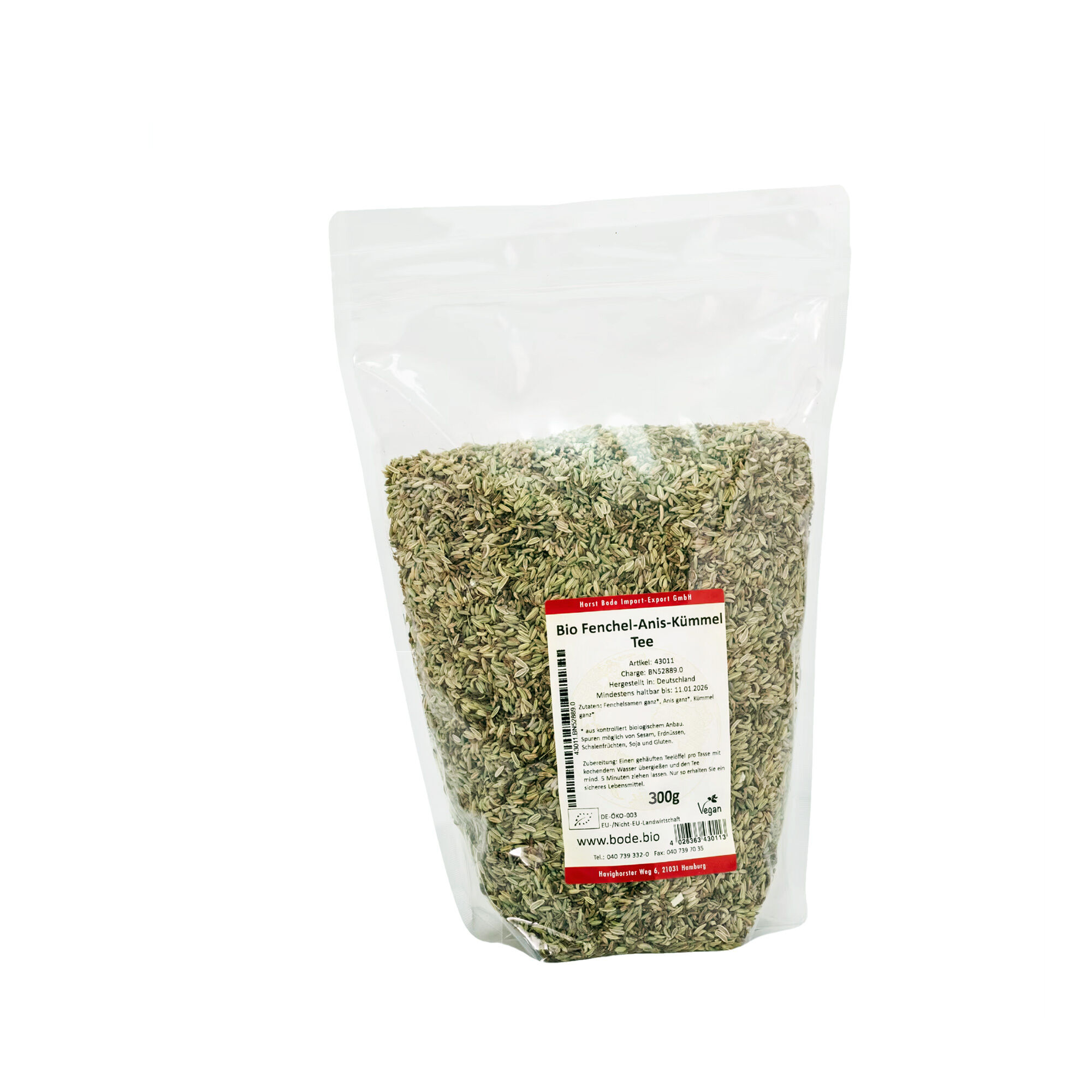 Klar genlukkelig plastikpose fyldt med 300 g økologisk fennikel-, anis- og kommen-te i løsvægt med hvid mærkat på forsiden