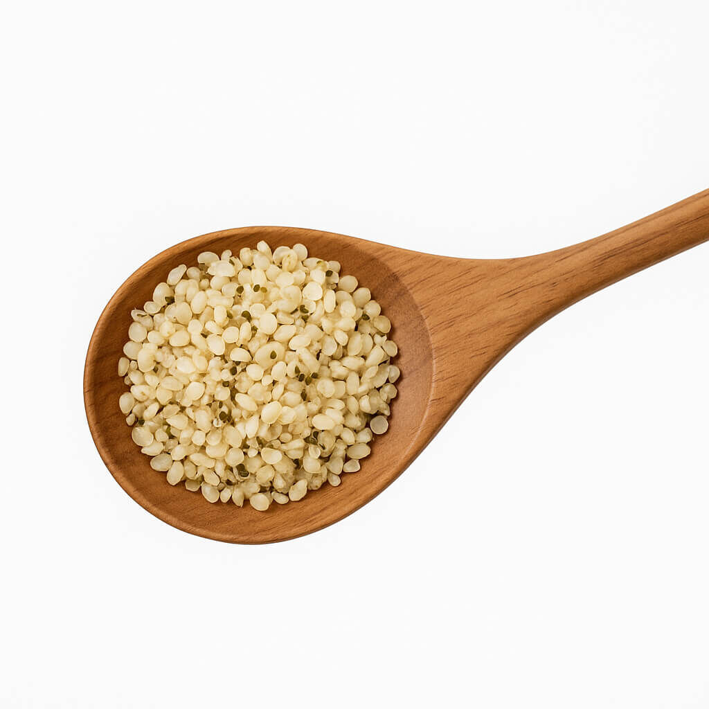 Close-up of wooden spoon holding hemp hearts