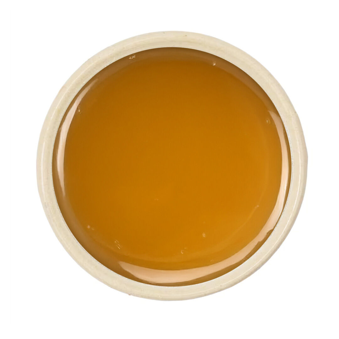 Top view of jar with golden honey
