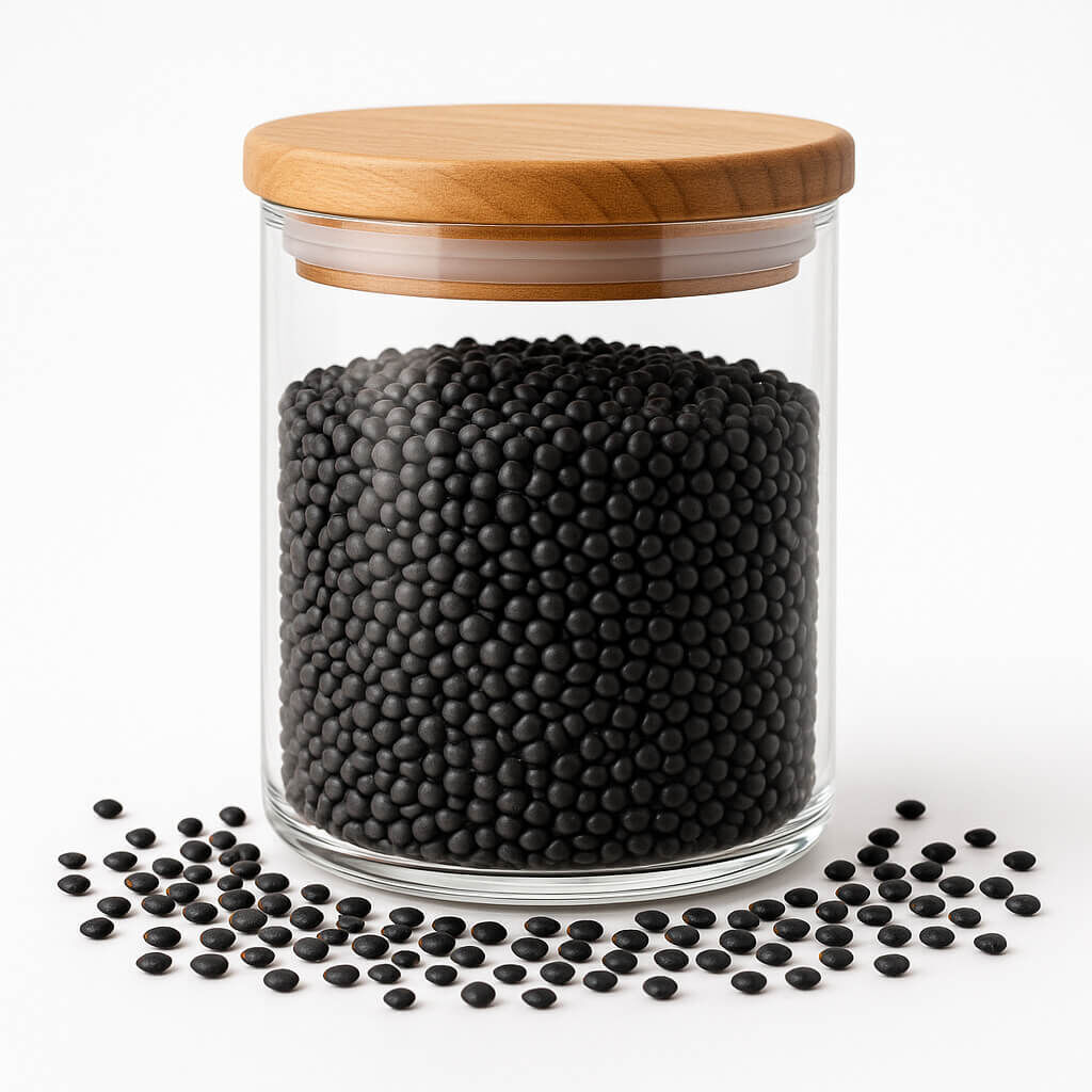Glass storage jar filled with black lentils