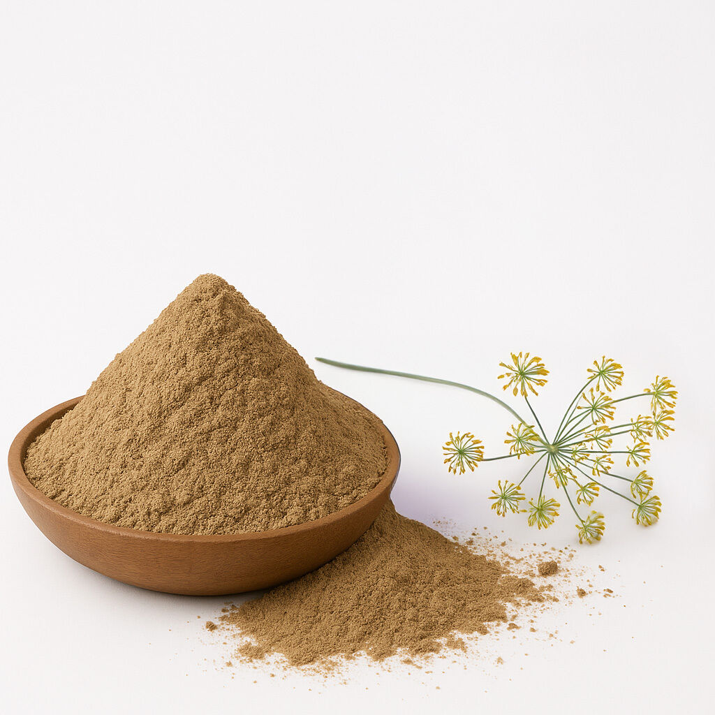 A wooden bowl filled with organic fennel powder next to a fennel flower on a white background