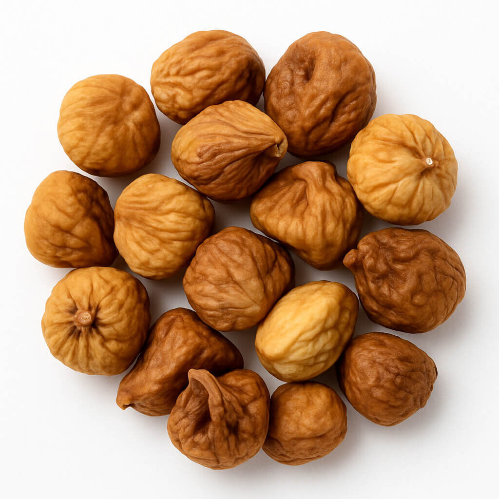 Close-up of dried figs on white background