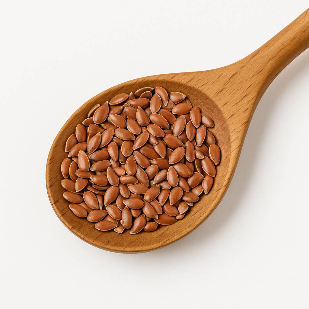 Brown flax seeds in wooden spoon